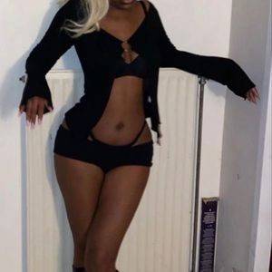 Black ring detail top with flared sleeves